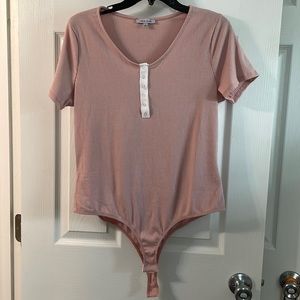 Pink short sleeve body suit